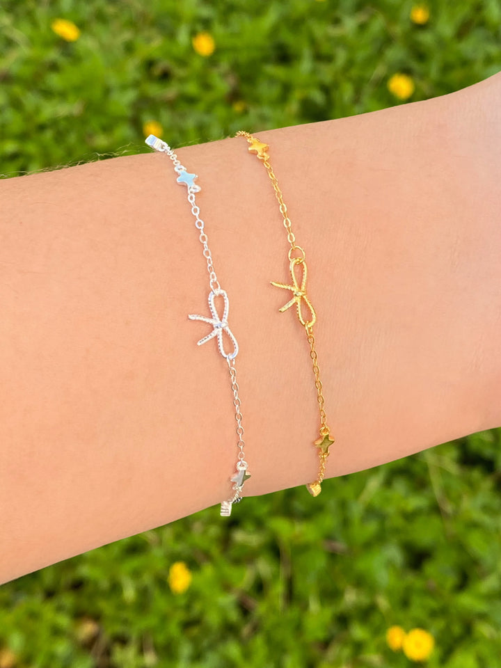 Pulsera Con Moño y Dijes