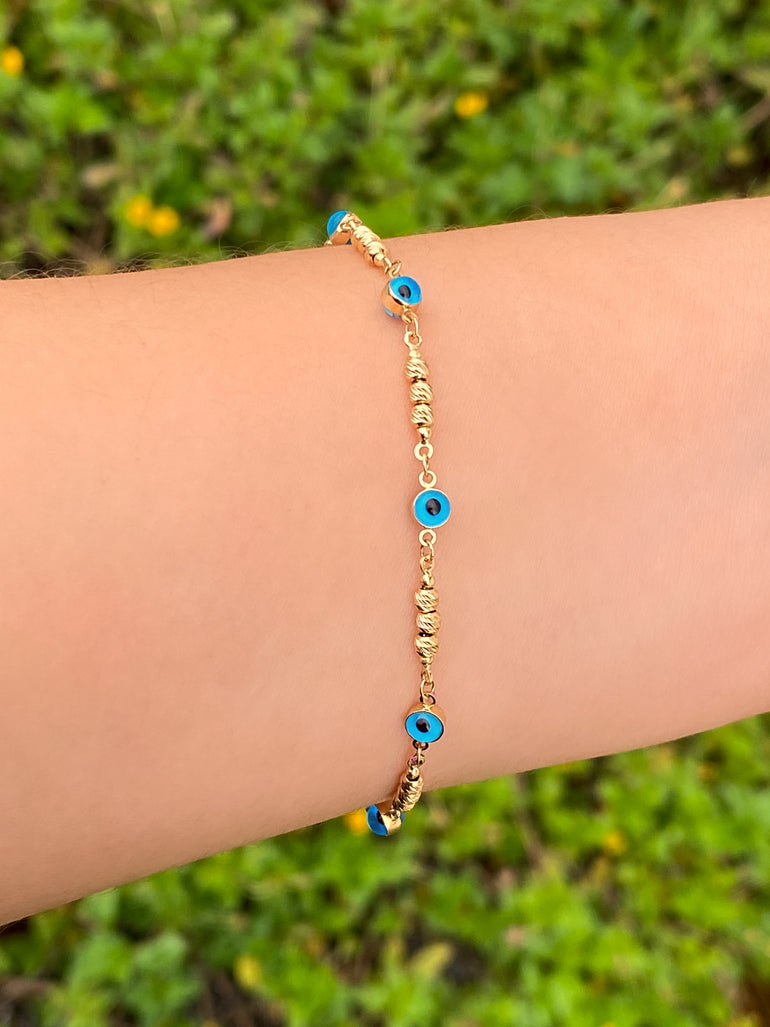 Pulsera Con Bolitas y Ojos Azules Oro 14k