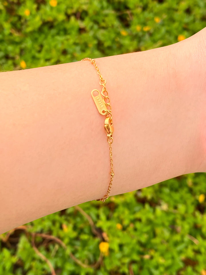 Pulsera Con Moño y Dos Corazones