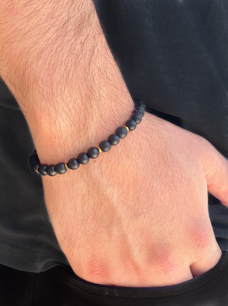 Pulsera Bolitas Negras con Dorado