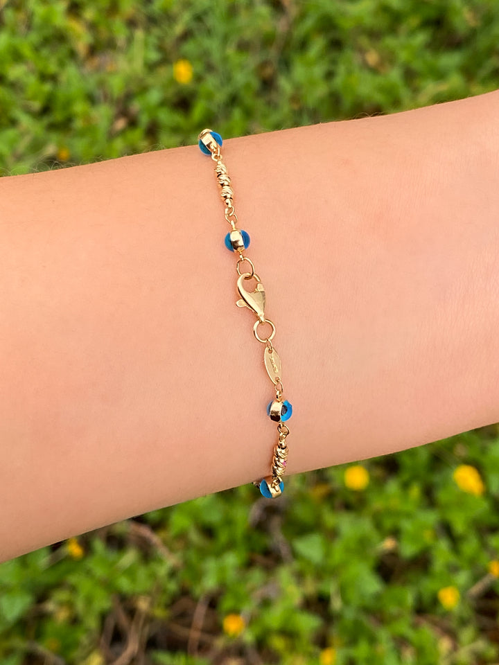 Pulsera Con Bolitas y Ojos Azules Oro 14k