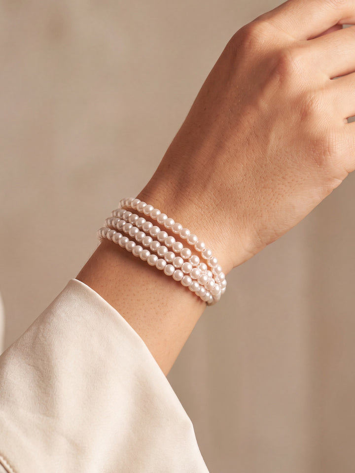 Pulsera Cuatro Lineas Perlas Hilo