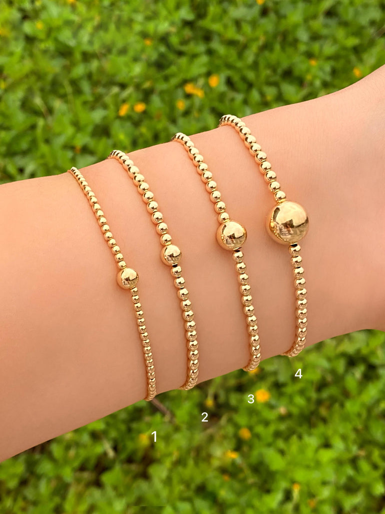 Pulsera Bolitas Chicas y Bolita Central Gold Filled